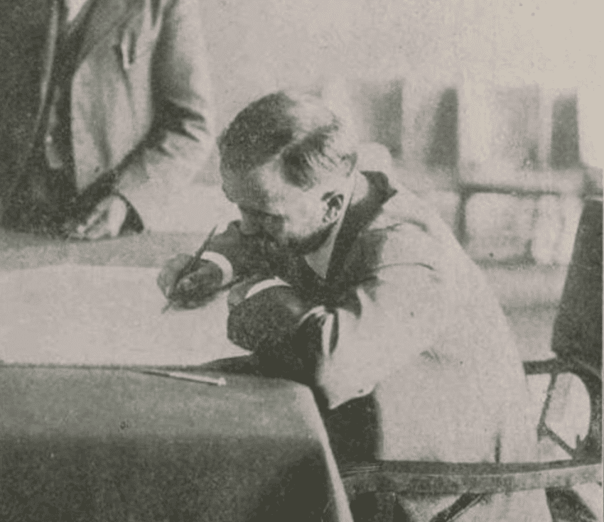 Madero writing at a desk