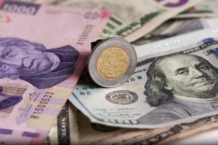 A stock photo of pesos and dollar bills and coins.