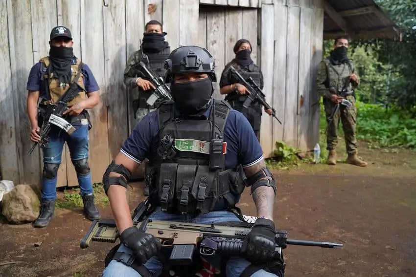 Cartel members pose with guns