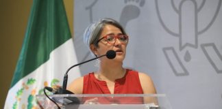 Karla Quintana at a press conference