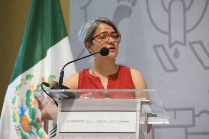 Karla Quintana at a press conference