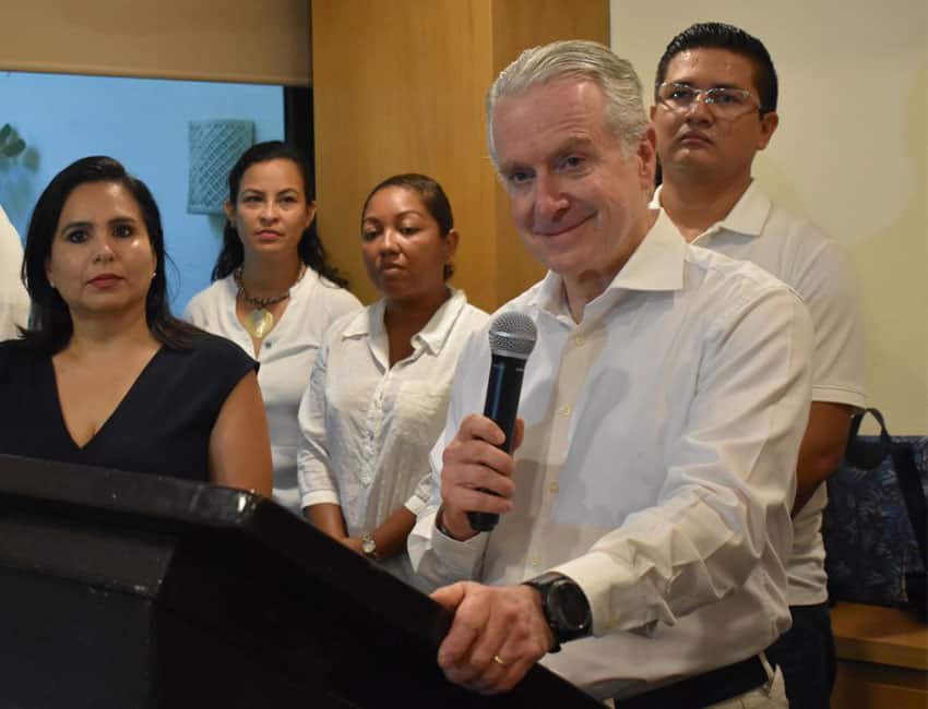 Mexican politician Santiago Creel holding a microphone