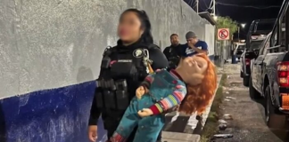 Chucky doll in handcuffs