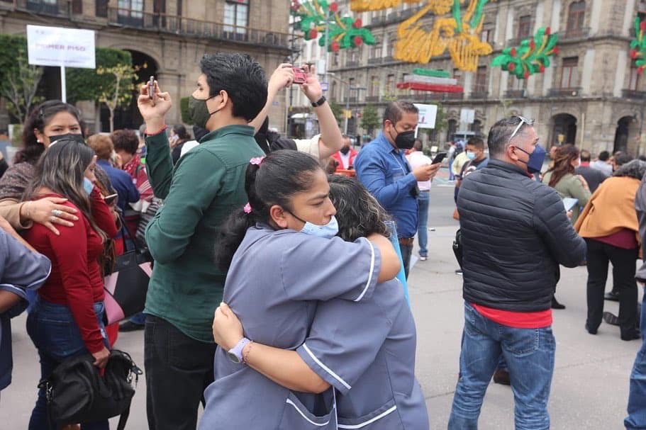 People embrace on streets of Mexico City
