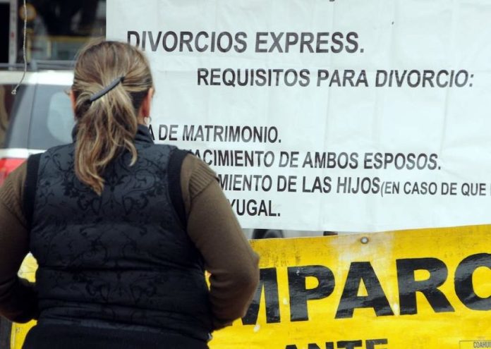 Woman looking at divorce sign