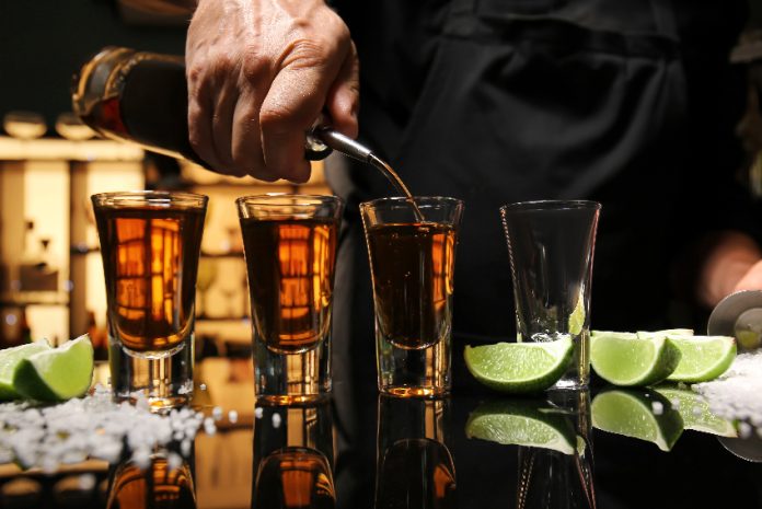 Bartender serving tequila