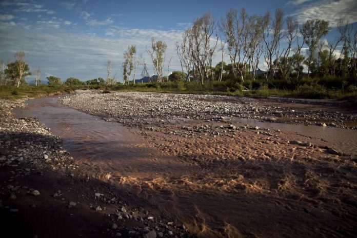 Sonora River turned reddish-orange after a mining company owned by Grupo México spilled hazardous waste into the river.