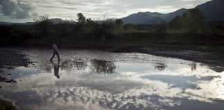 Man crosses the Sonora River