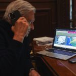 AMLO on the phone viewing hurricane data