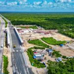 An overhead shot of under-construction stop of the Maya Train, surrounded by rainforest.
