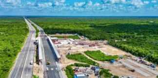An overhead shot of under-construction stop of the Maya Train, surrounded by rainforest.