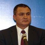 Former Mexican official Genaro García Luna stands at a microphone