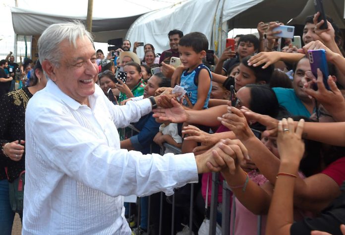 President López Obrador greets people