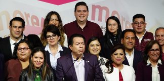 A group of politicians at a podium