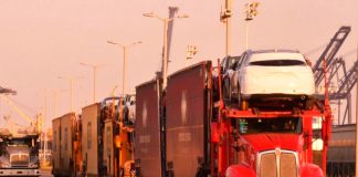 Trailers full of cars wait to be loaded onto ships at a dock in Veracruz