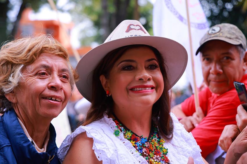 A close up of Clara Brugada outdoors wearing a hat