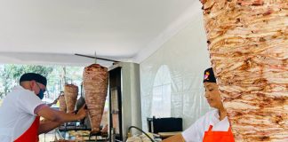 Taquería Don Rey employees prepare tacos al pastor