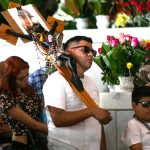 Man in a church with a cross