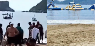 Beach where woman was brought ashore after shark attack