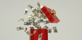 A red box full of Mexican pesos, representing thee holiday aguinaldo bonus