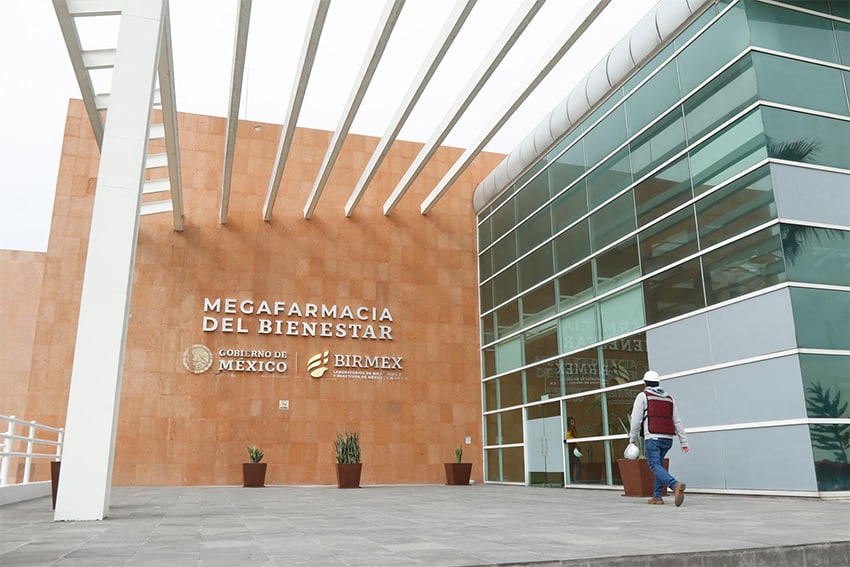 A large building entrance with a sign reading "Megafarmacia del Bienestar"