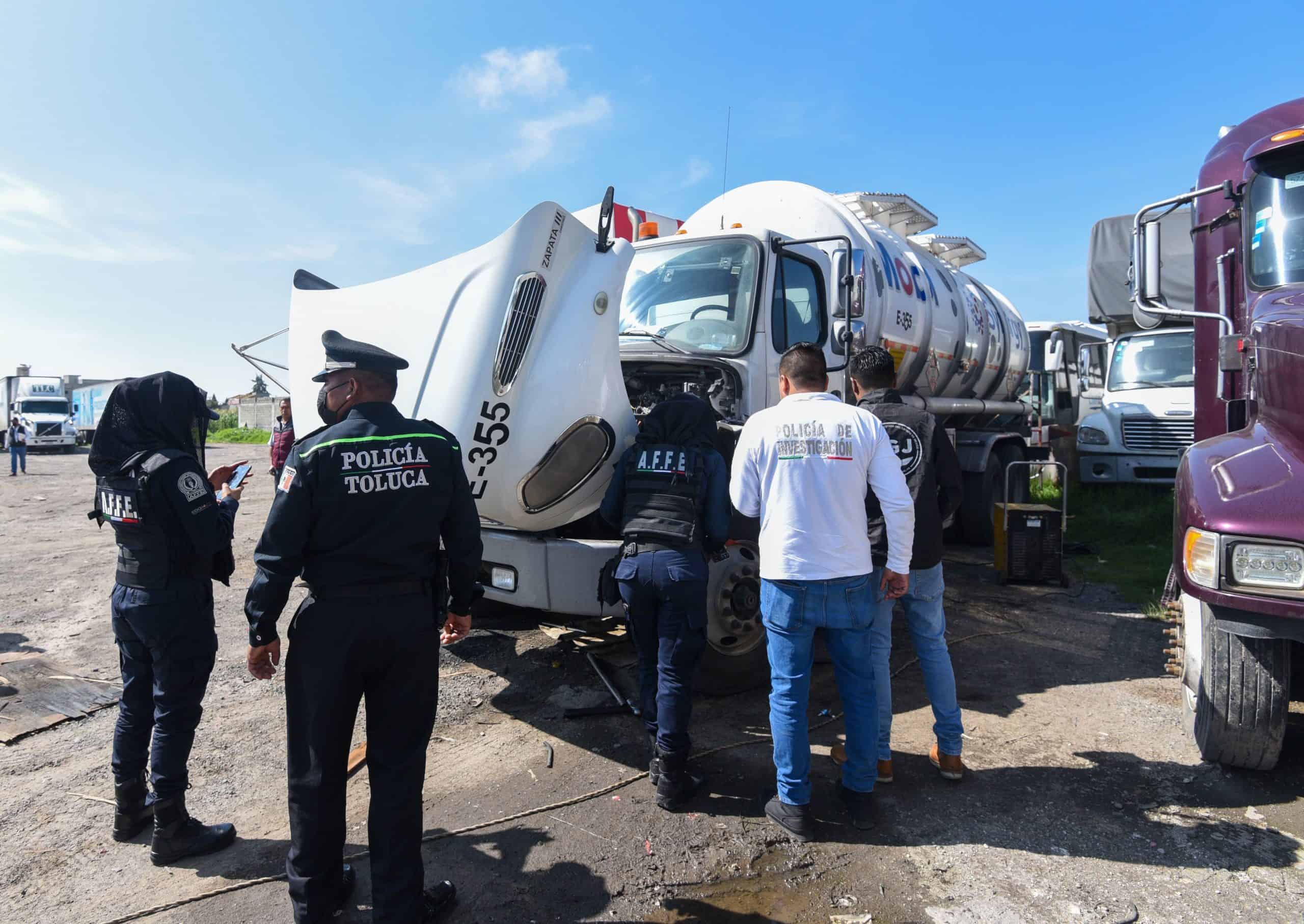 Toluca police inspecting a truck