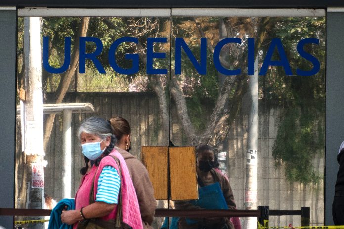 Woman with a mask outside of a hospital in Mexico City