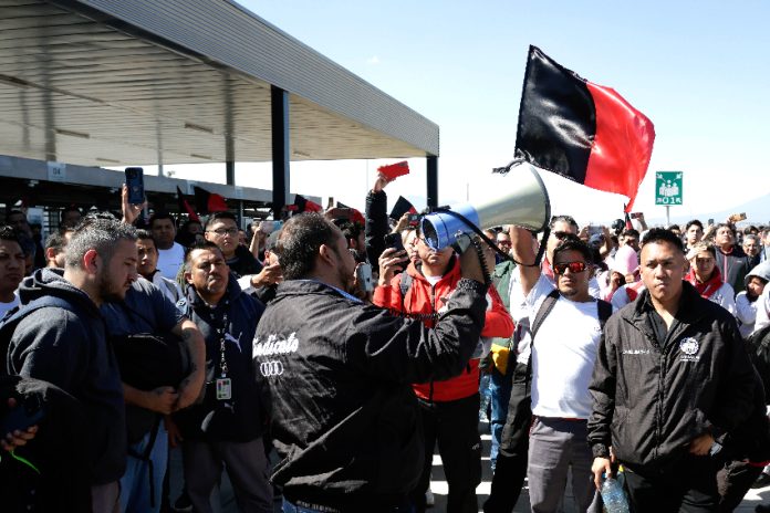 Workers protest outside of Audi plant in Puebla