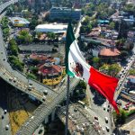 Mexican flag seen from above over Mexico City