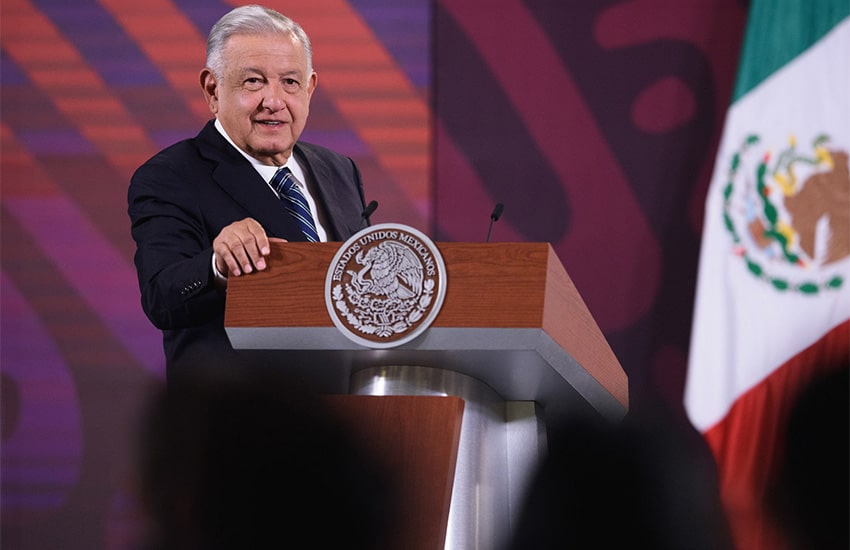 Mexican president Andres Manuel Lopez Obrador standing at a podium in the National Palace
