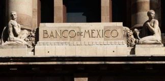 Close up of the Bank of Mexico building showing its name in gold lettering