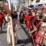 Jesus carries the cross, in a scene from the 2023 Iztapalapa Passion Play.