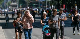 Tourists enjoy a Sunday walk on Paseo de la Reforma in Mexico City.