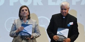 Mexico's presidential candidate Xochitl Galvez, left, stands with Rogelio Cabrera, head of the Mexican Episcopal Conference