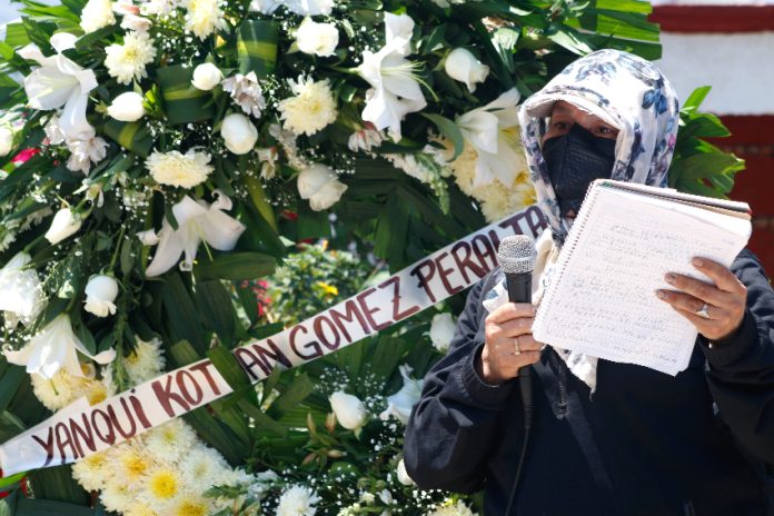 A memorial wreath for dead student Yanqui Kothan Gómez