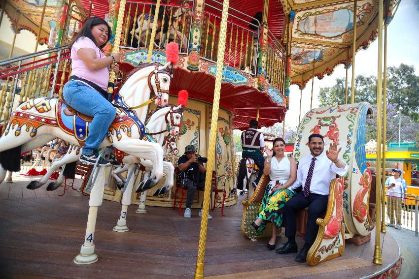 Mexico City Mayor Martí Batres on a merry go round