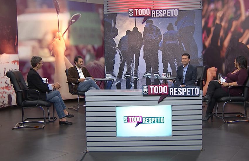 Three men and one woman sitting around a desk on a still from the Mexican political show Con Todo Respeto