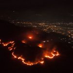 An aerial view of forest fires at night, outside the city of Acapulco