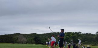 People teeing off at Las Parotas Golf Club in Huatulco, Mexico