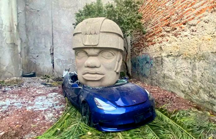 Olmec head vs Tesla car
