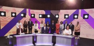 The 2024 presidential candidates sit at their podiums ahead of the first debate