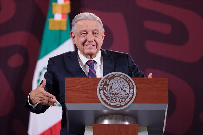 Mexico's President Lopez Obrador gesturing behind a podium during his press conference