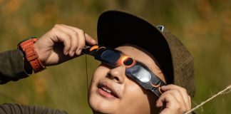 Boy wearing eclipse glasses