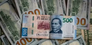 Mexican peso bill and US dollar bills