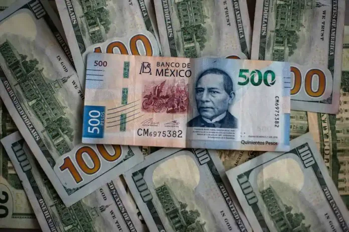 Mexican peso bill and US dollar bills