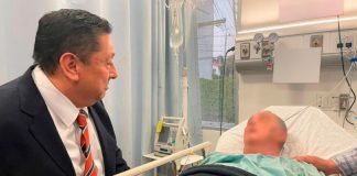 Morelos Attorney General Uriel Carmona visits Bishop Salvador Rangel in the hospital