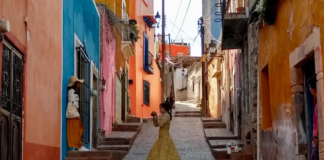 A woman dances in the urban streets of Guanajuato, Mexico
