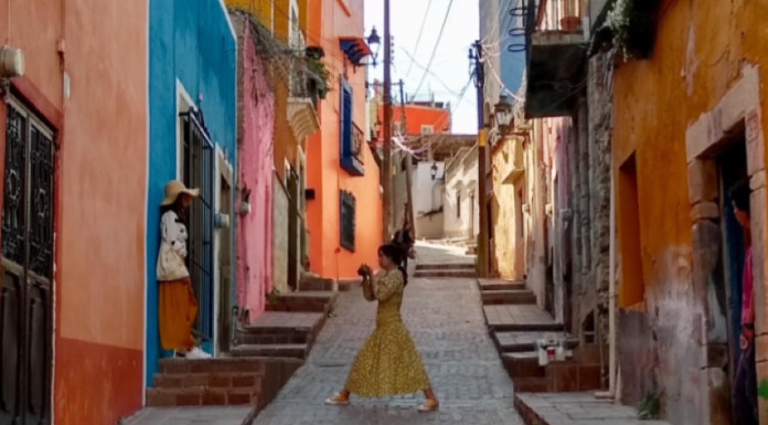 A woman dances in the urban streets of Guanajuato, Mexico