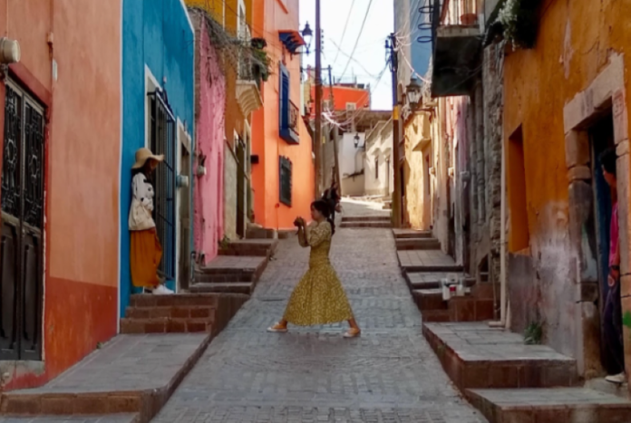 A woman dances in the urban streets of Guanajuato, Mexico