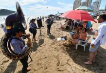 Banda musicians play for tourists on the beach in Mazatlán.